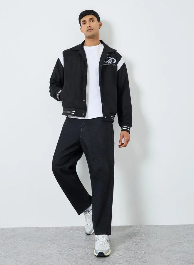 Styli Men Black Relaxed Graphic Varsity Jacket